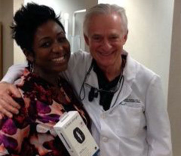 Dr. Kauffman with a smiling female patient